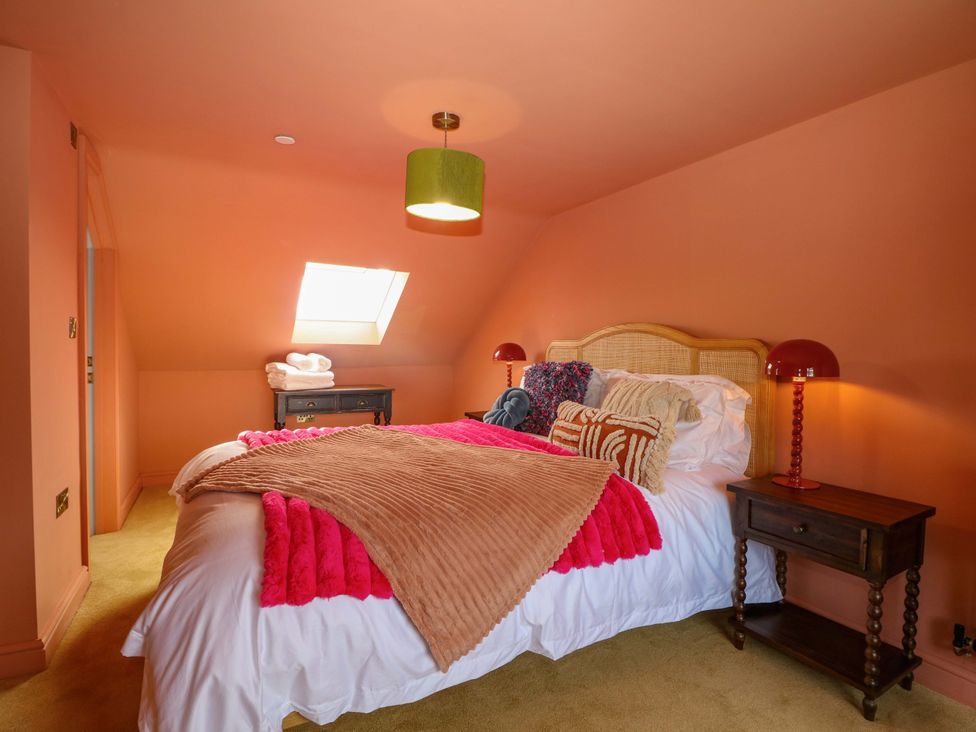 A bedroom with a bed and nightstand at Hasting Heights, Hastings