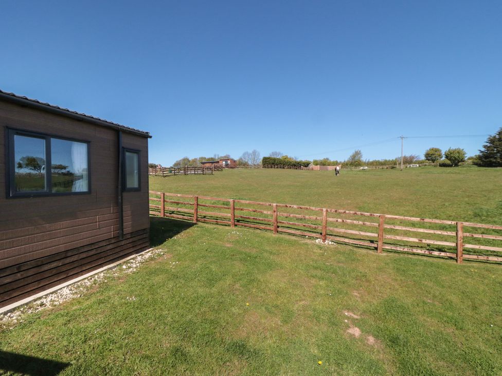 A view of a lawn and fence at Fir Lodge in Whitby