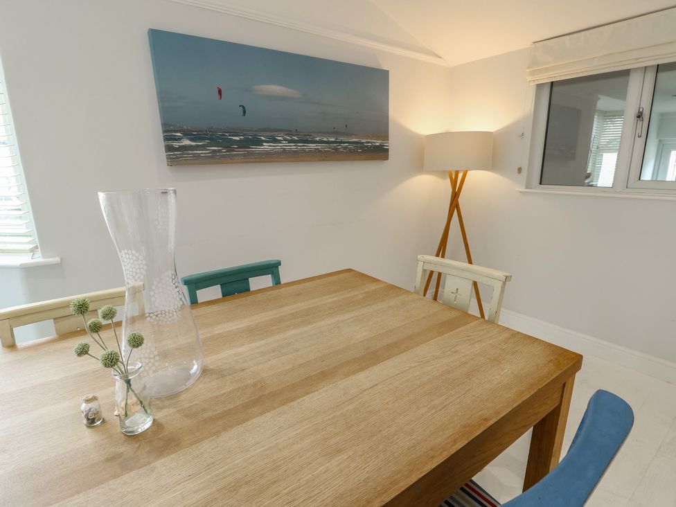 A dining room with a table and chairs at Gorse Hill