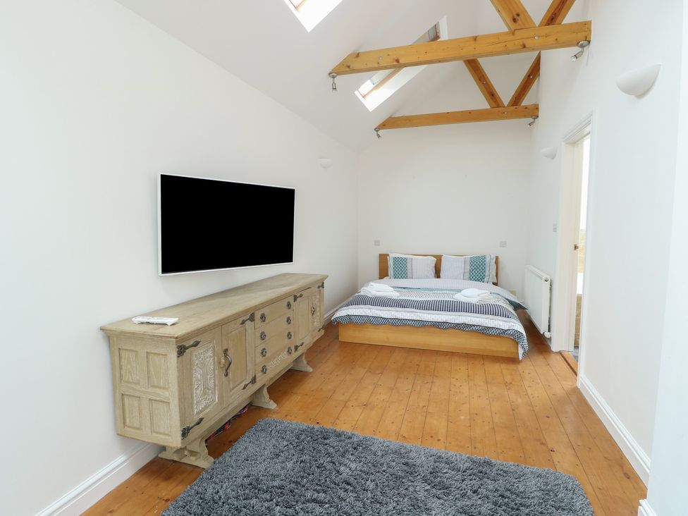 A bedroom with a bed and television at Gorse Hill 