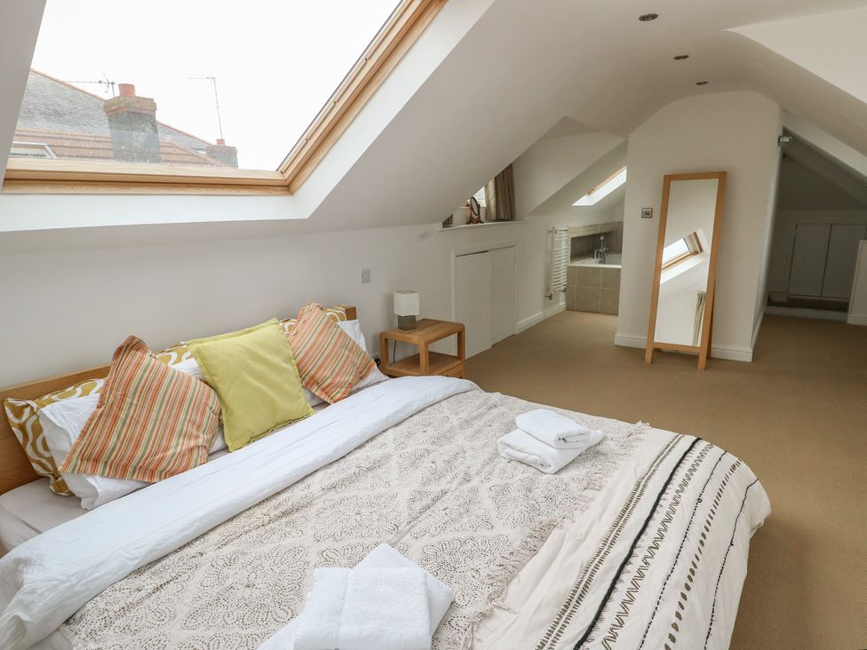 A bedroom with a bed and skylight at Gorse Hill