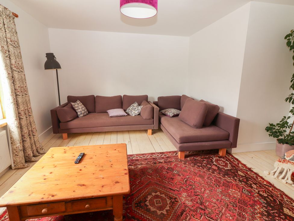 A living room with sofas and a coffee table at Shanti Gher in Bantry