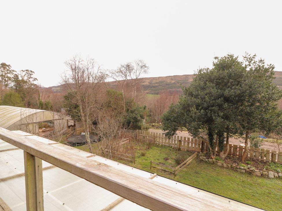 A view of trees and land from a balcony at Shanti Gher in Bantry