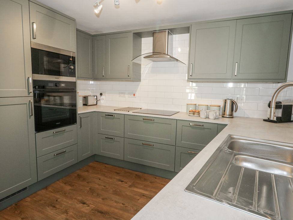 A kitchen with appliances and cabinets at Betty's Buoy in Weymouth