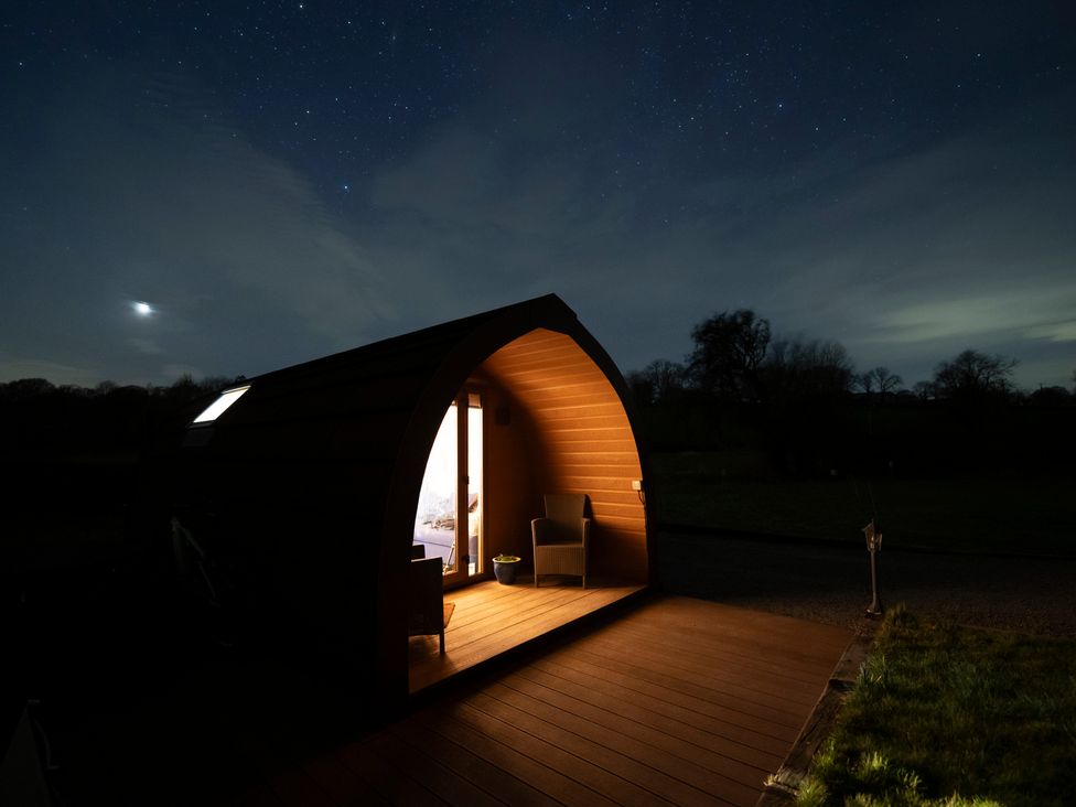 A hut with lighting at night with a view of the stars at Ty Twt Teifi Tregaron