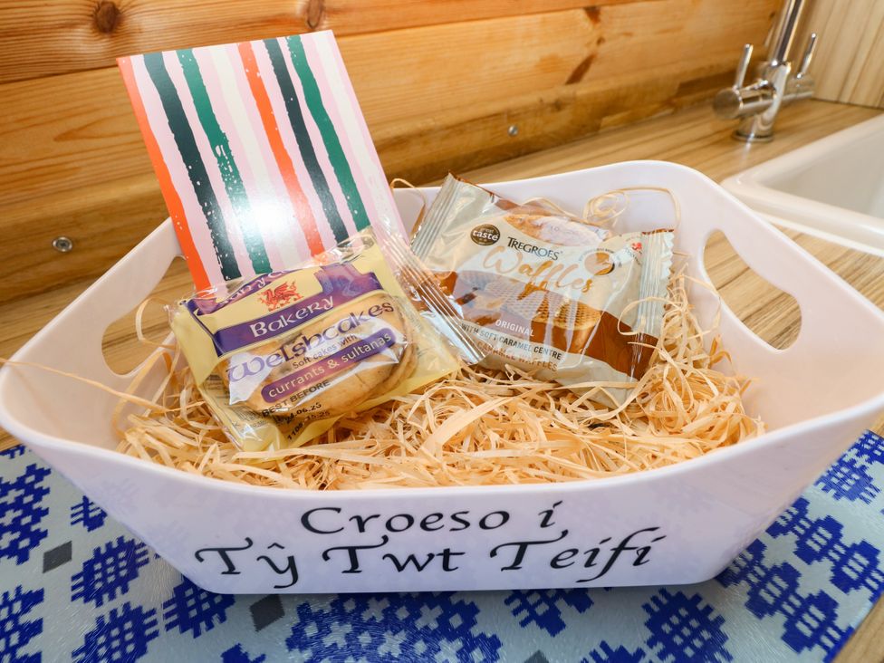 A basket with Welsh cakes and waffles at Ty Twt Teifi in Llanddewi-Brefi