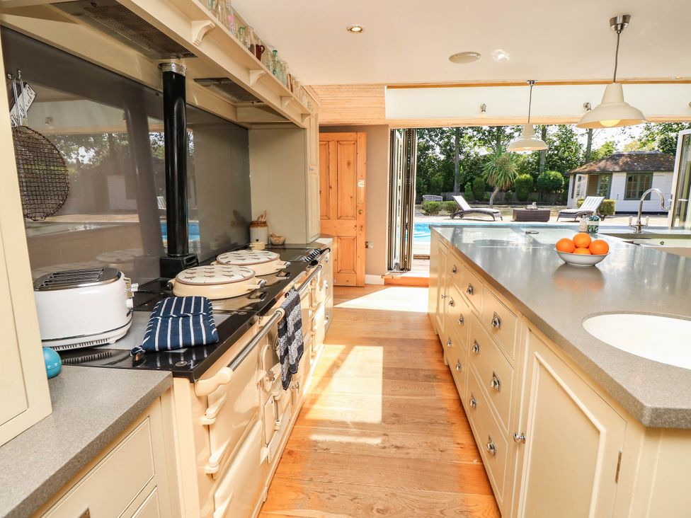 A kitchen with a cooking range and sink at Beam Cottage in Warsash