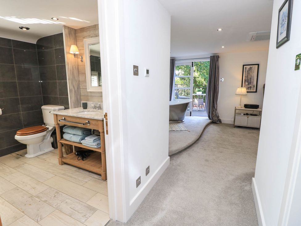A bathroom with a sink and toilet visible at Beam Cottage in Warsash