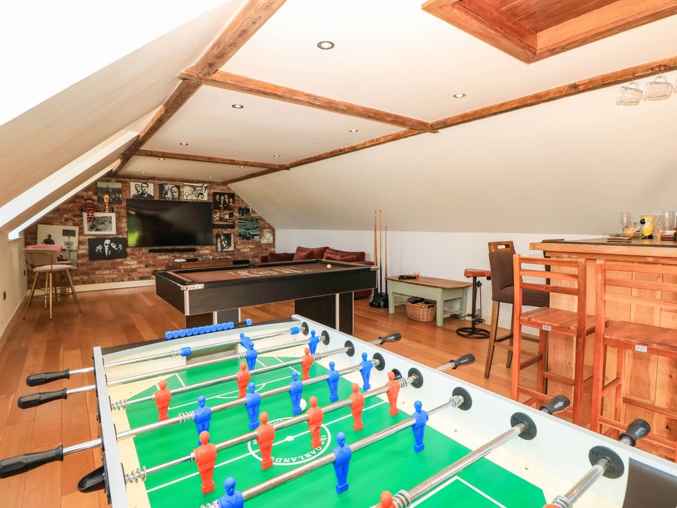 A games room with a foosball table and pool table at Beam Cottage in Warsash