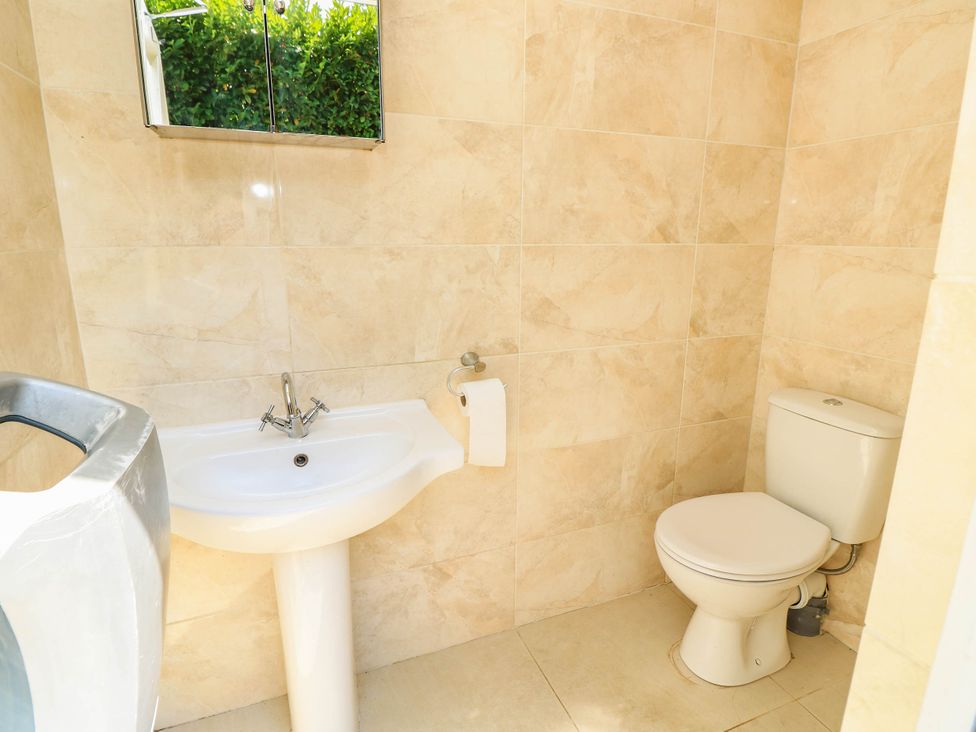 A bathroom with a sink and toilet at Beam Cottage in Warsash
