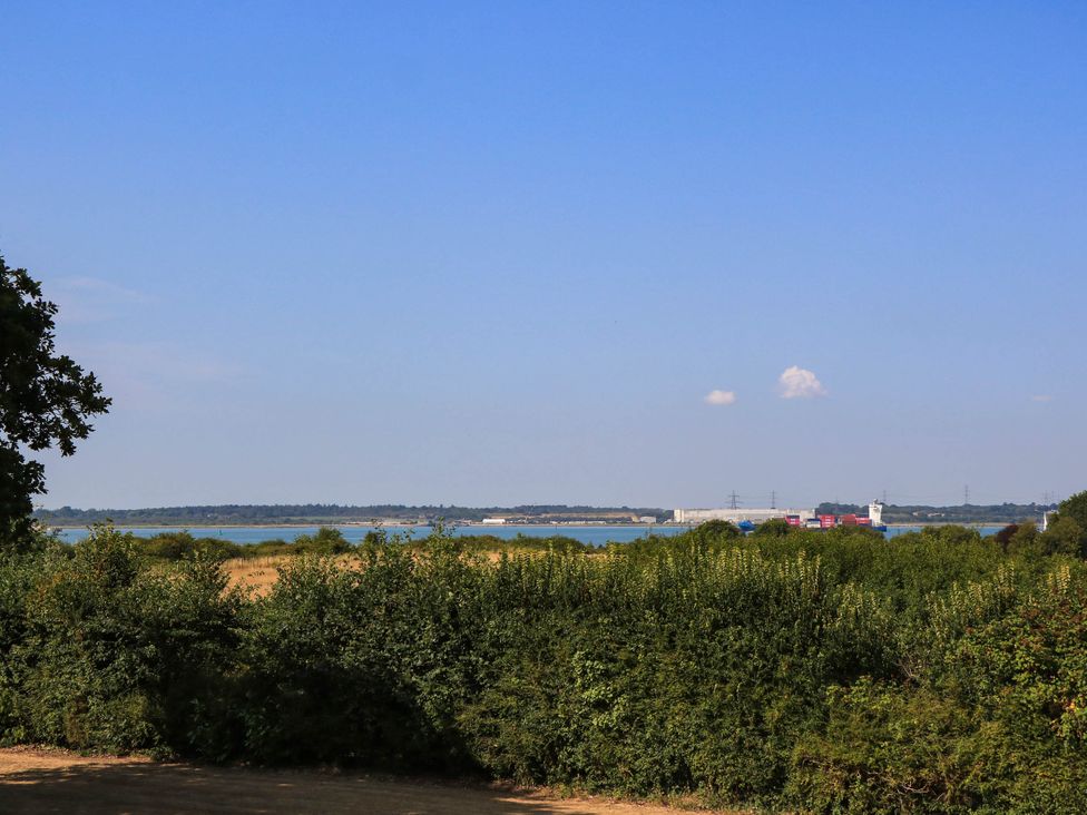 A landscape with water and trees at Beam Cottage in Warsash