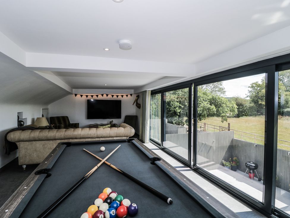 A game room featuring a pool table and large windows at Number 7 in Bishop Sutton