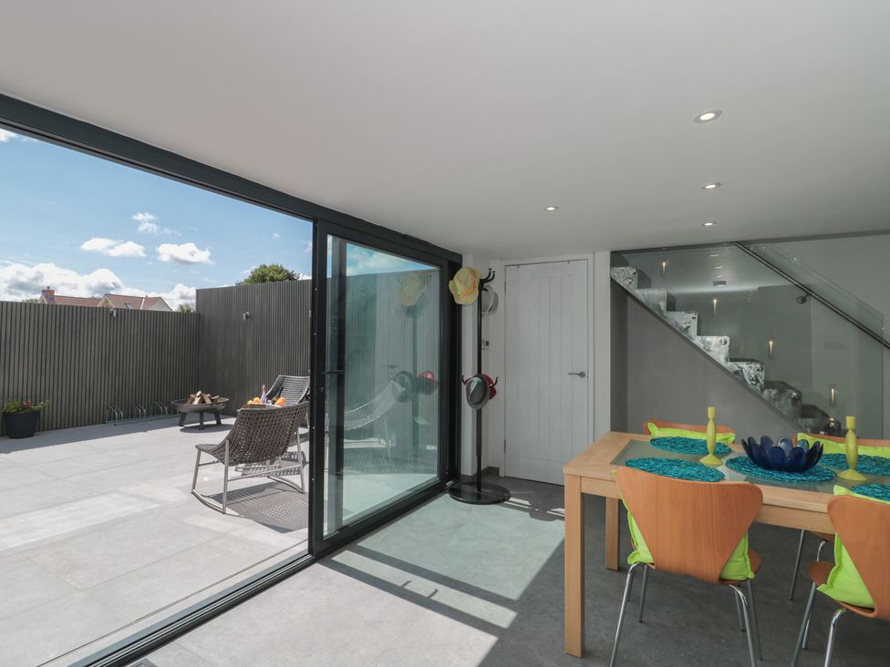 A dining room with a table and chairs at Number 7 in Bishop Sutton