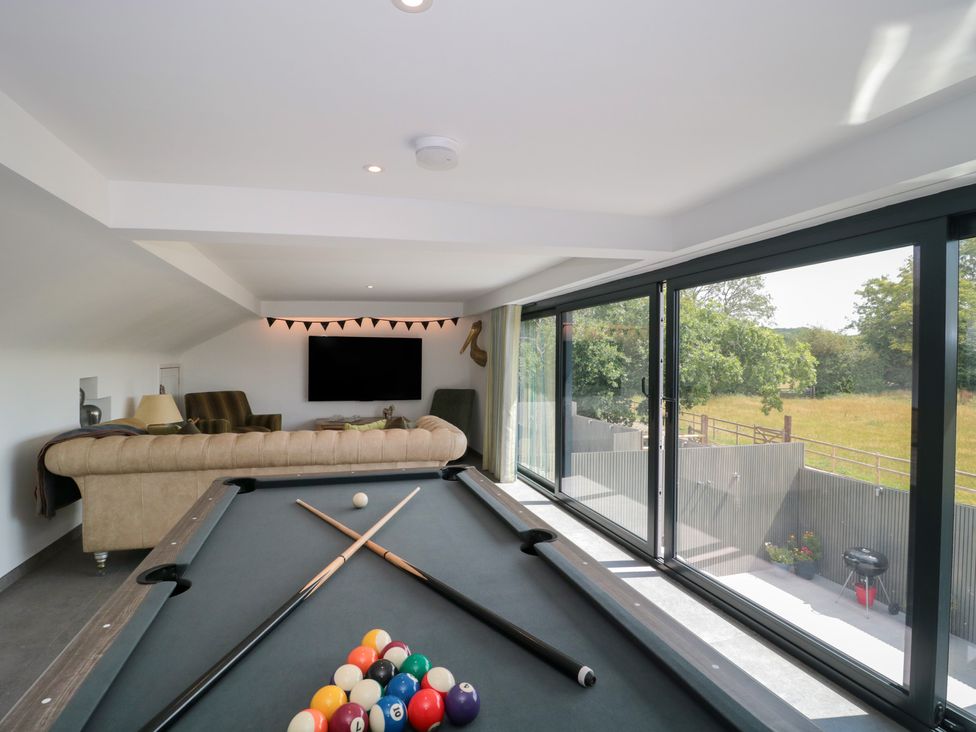 A recreation room with a pool table and a sofa at Number 7 in Bishop Sutton