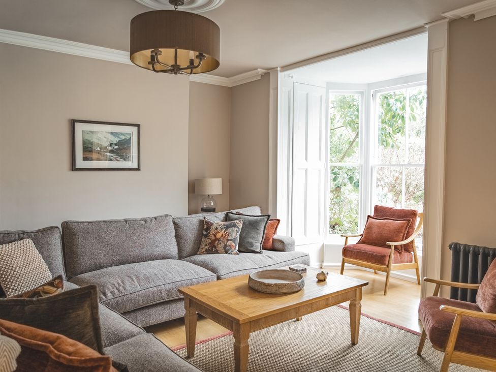 A living room with a sofa and coffee table at Tan Llan near Llanelltyd