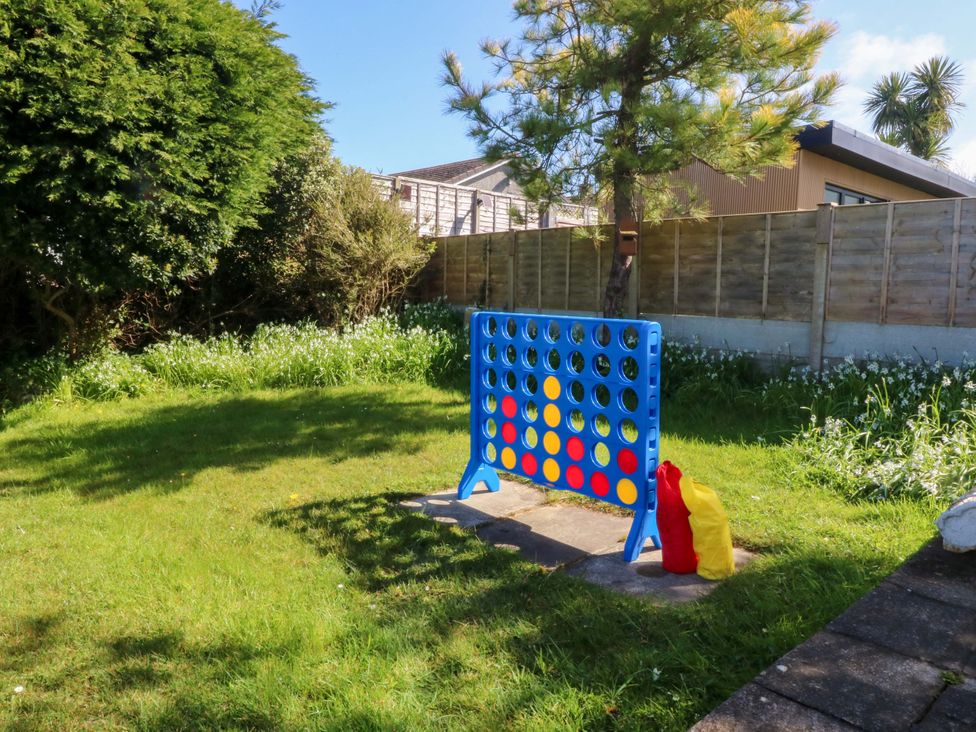 A connect four game board in the garden at 20 Gwelfor Estate Cemaes Bay