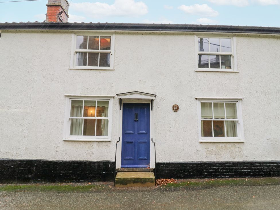 A house with blue door and windows at White Gates Banham