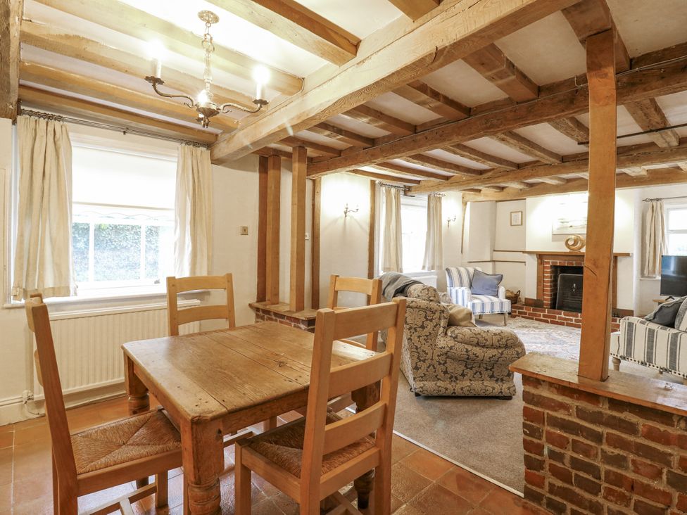 A dining area with a table and chairs at White Gates in Banham
