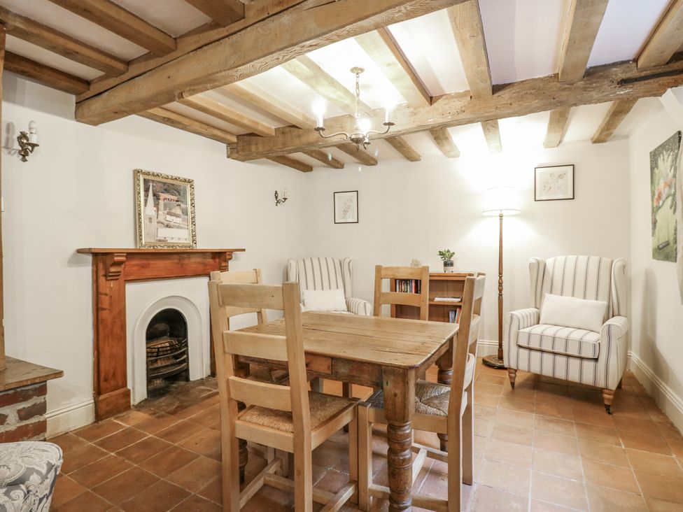 A dining room with a table and chairs at White Gates in Banham