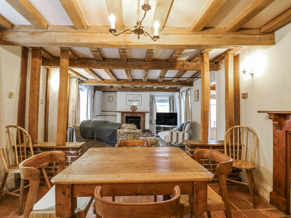 A living room with a table and chairs at White Gates in Banham
