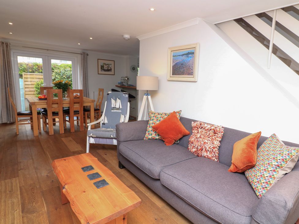 A living room with a sofa and coffee table at Eydon in Salcombe