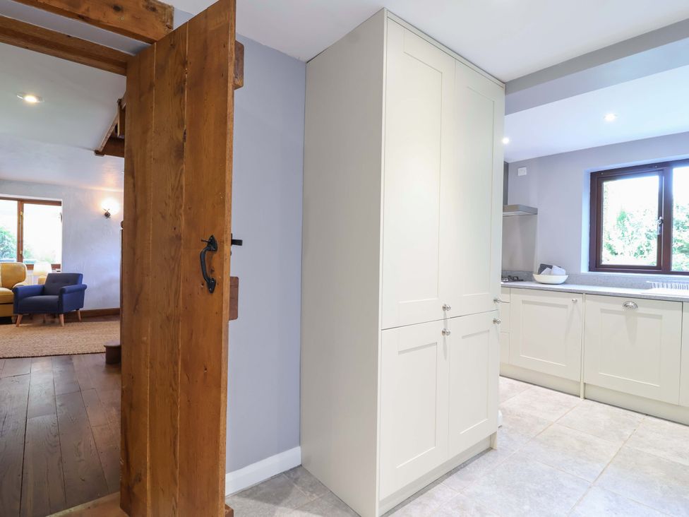 A kitchen with cabinetry and countertop at 1 Eastdon Cottages in Exeter