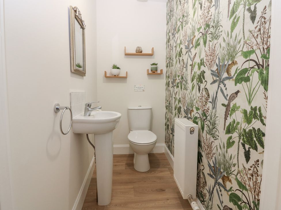 A bathroom with a sink and toilet at 21A High Street Jedburgh