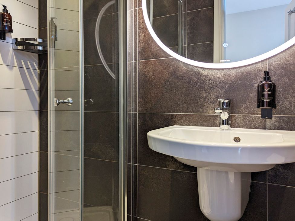 A bathroom with a sink and shower at Rosemount Boutique in Windermere