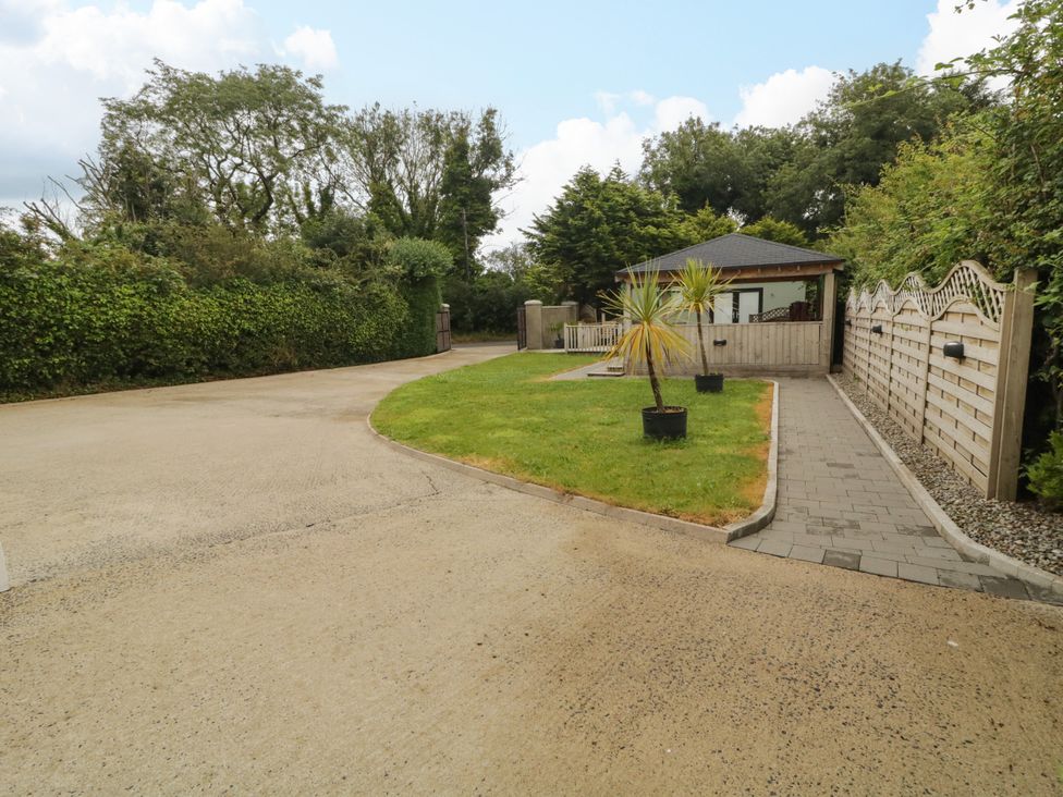 A driveway leading to a garden area at Woodside Guest House in Castlerock