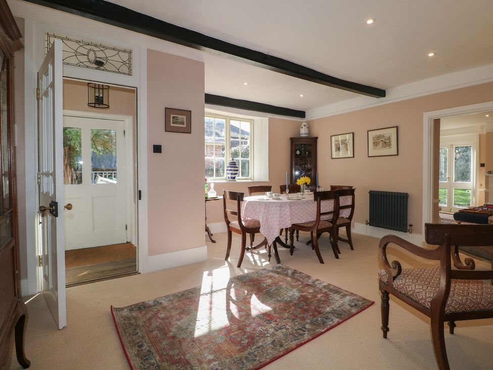 A dining room with table and chairs at Rectory Cottage near Alton, Hampshire