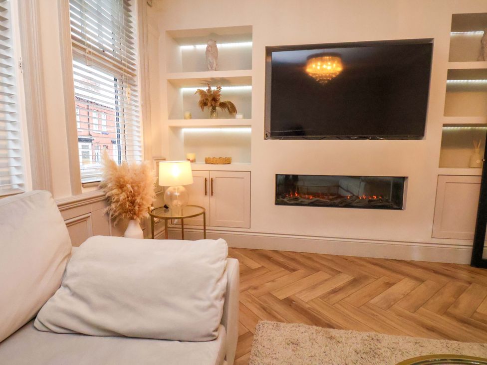 A living room with a television and fireplace at 59 Moorland Road Scarborough