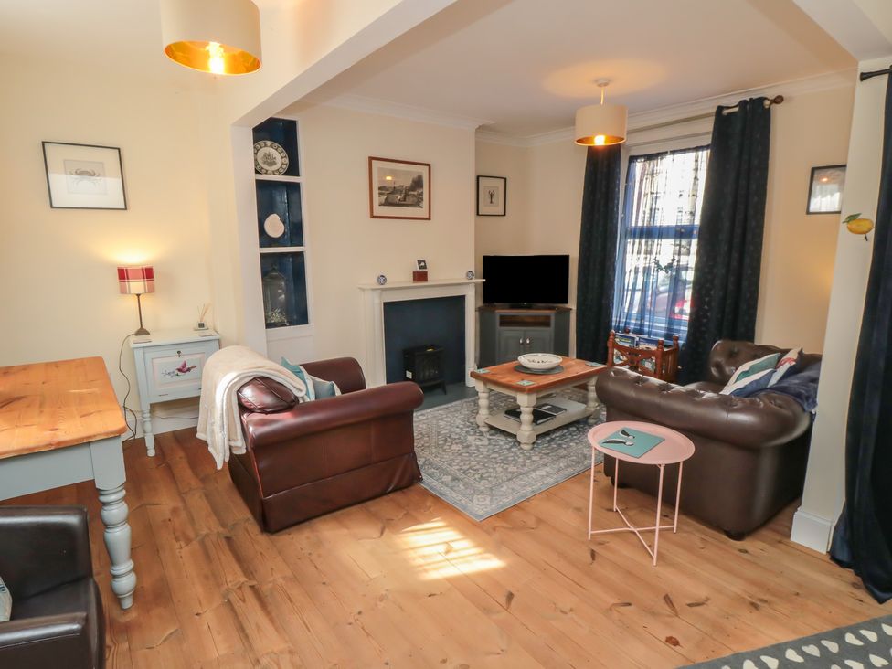 A living room with a sofa and coffee table at 1 Albion Place Whitby