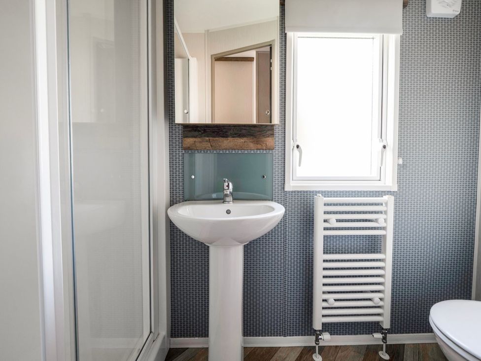A bathroom with a sink and toilet at Blue Flag Shores - Hayling Island