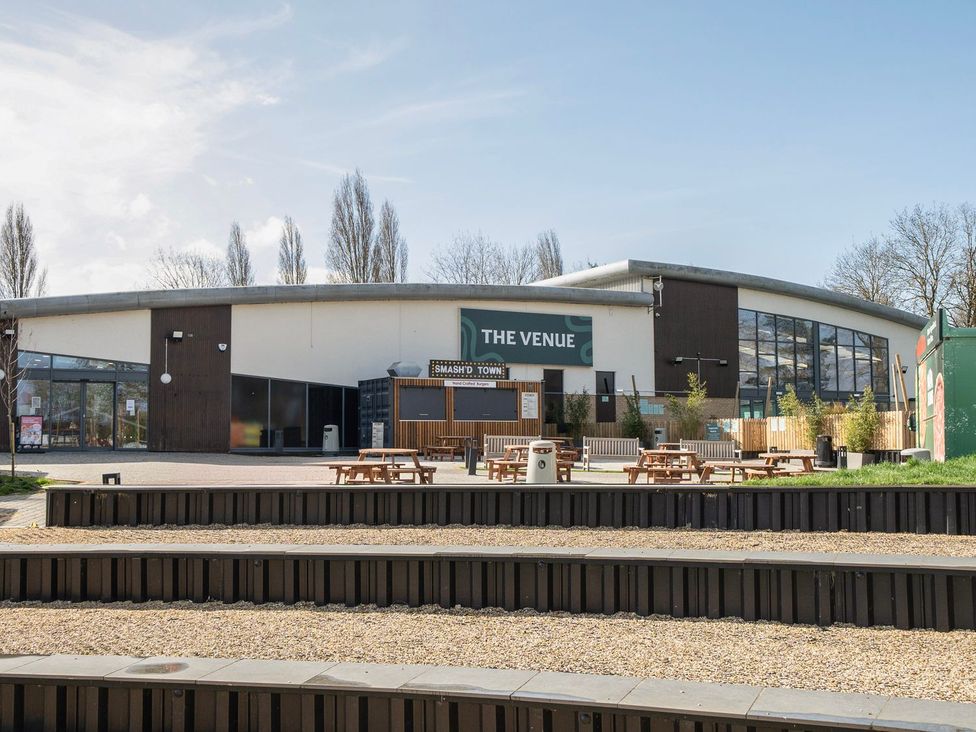 An outdoor venue with seating and tables at The Splash Pad - Billing Aquadrome
