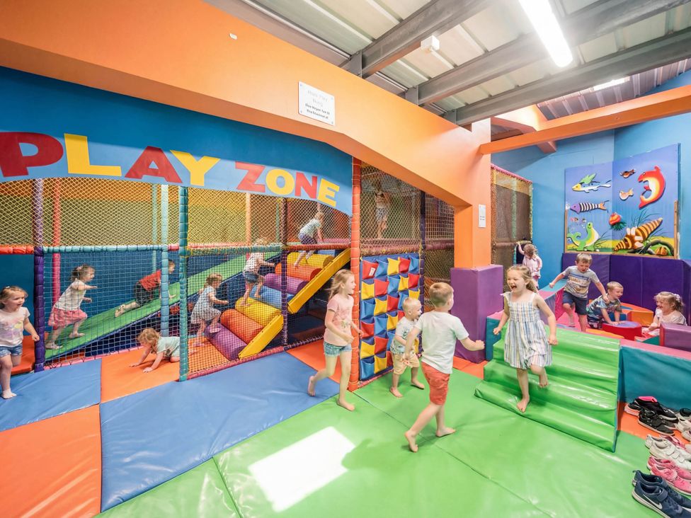 An indoor play area with play equipment at The Splash Pad - Billing Aquadrome