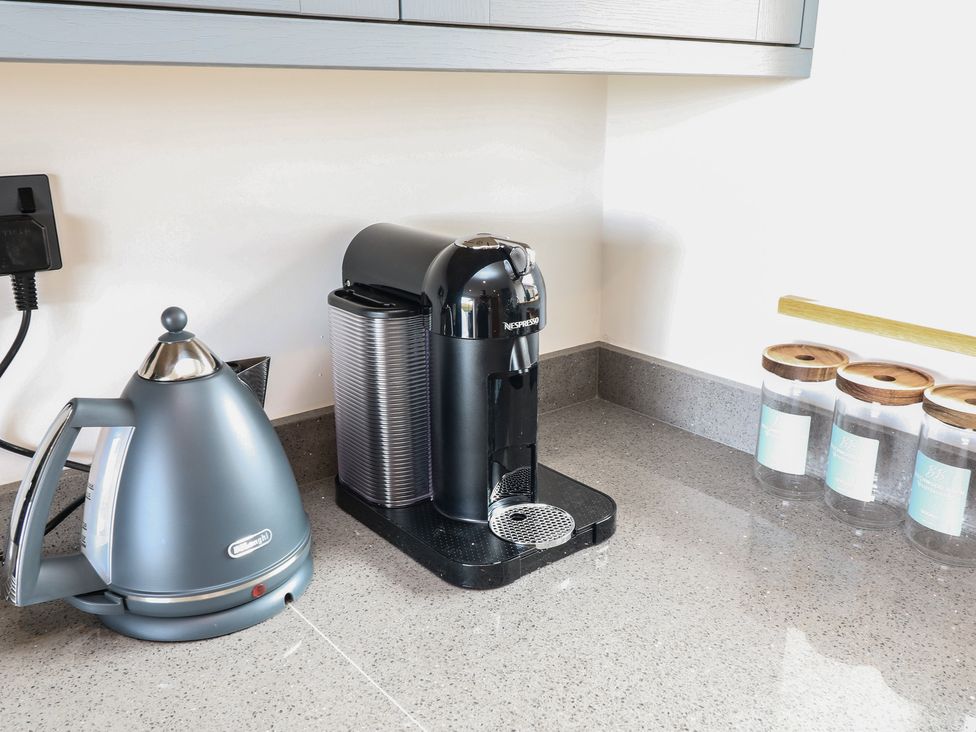 A kettle and coffee machine on a countertop at Buzzard Barn Woodhall Spa