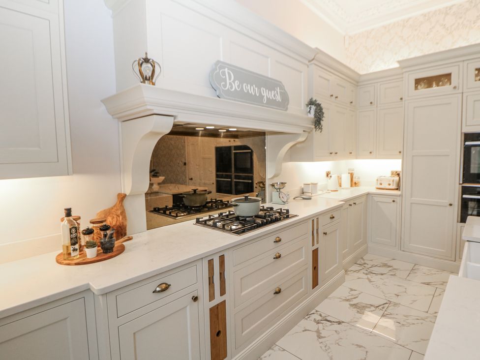 A kitchen with counter space and appliances at Hallfield Hall in Shirland near Higham