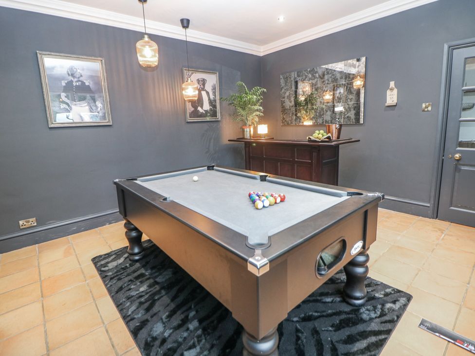 A games room with a pool table and bar at Hallfield Hall Cottage in Shirland