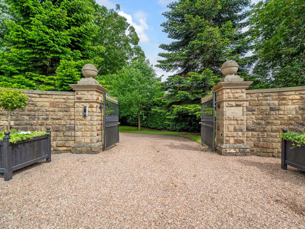 Gates and pathway at Hallfield Hall Cottage in Shirland