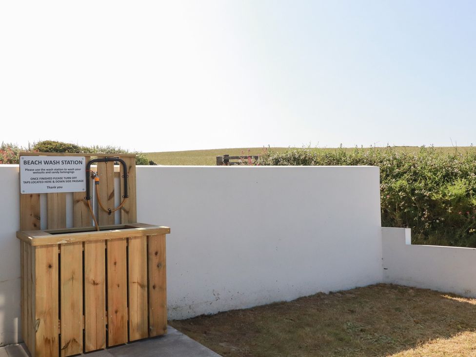 A beach wash station with taps at Jacana in Perranporth