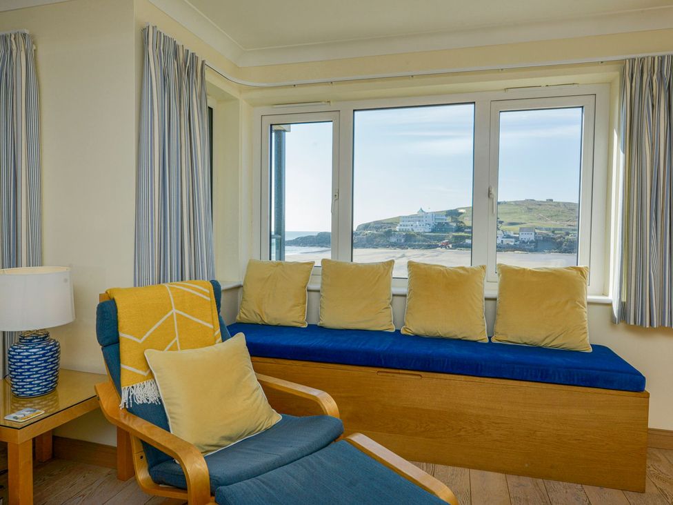 A living room with a window view and seating at Apartment 12, Burgh Island Causeway Bigbury-On-Sea