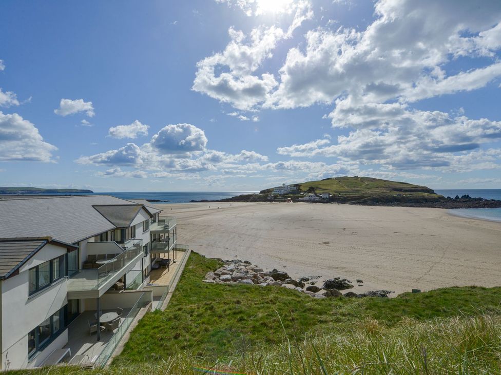 A beach view with a building and sea at Apartment 12, Burgh Island Causeway in Bigbury-On-Sea