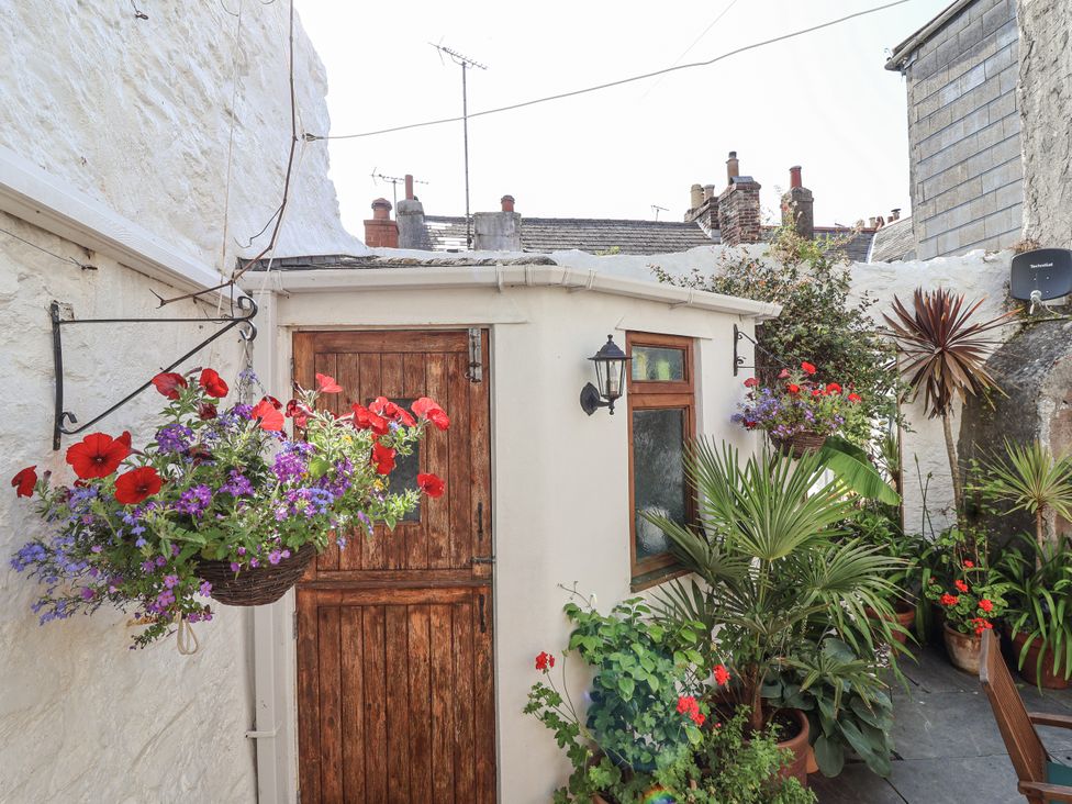 An outdoor area with a door and flowers at Springfield in Kingsand