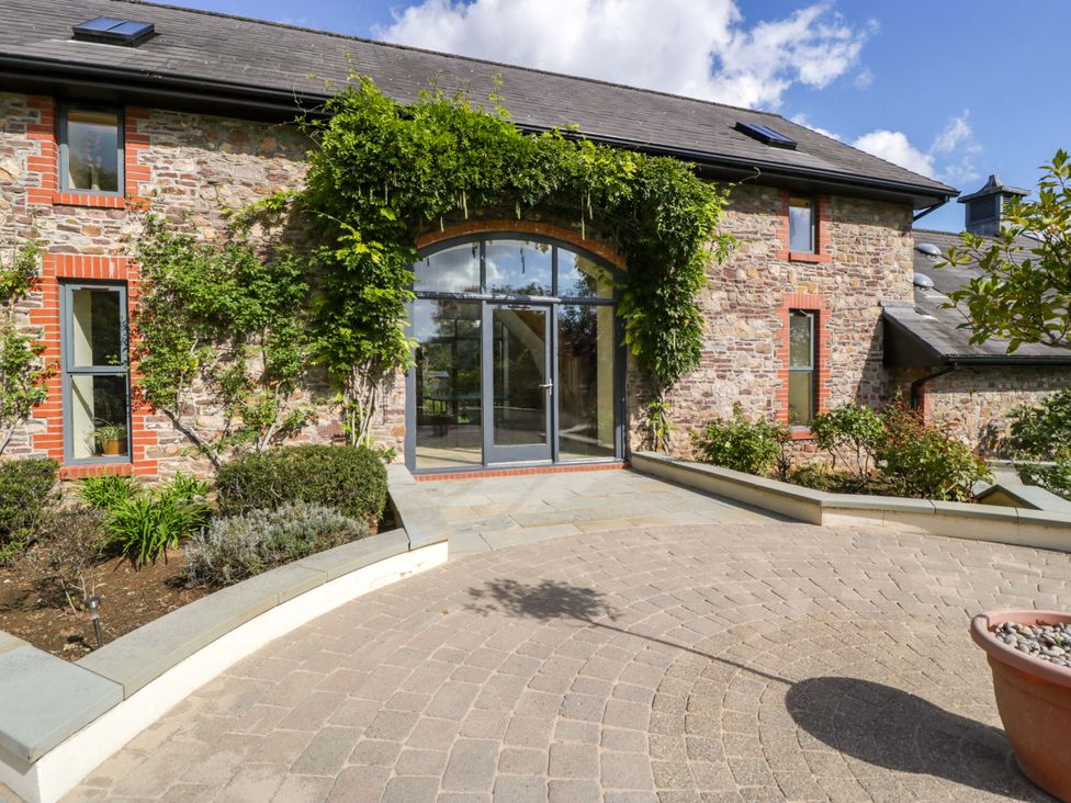 An outdoor area with a stone entrance at Heathcliffe House in Castleton near Cardiff