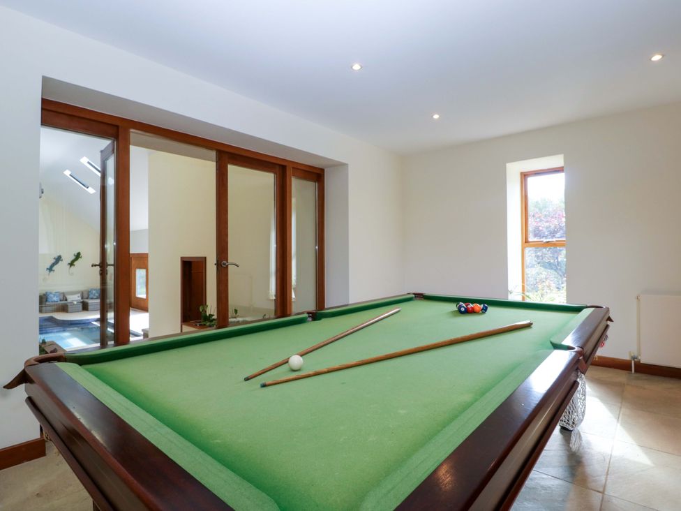 A games room with a pool table at Heathcliffe House Caslteton near Cardiff