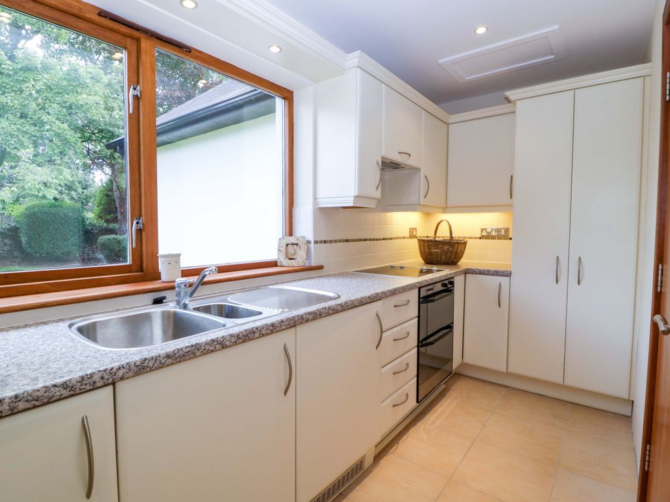 A kitchen with a sink and countertops at Heathcliffe House Caslteton near Cardiff