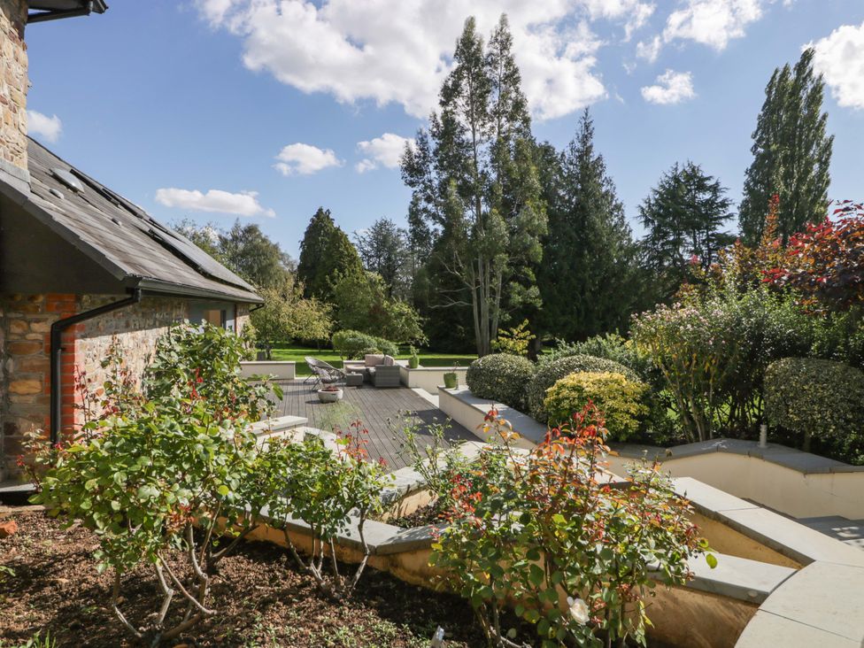 A garden with outdoor furniture and plants at Heathcliffe House in Castleton near Cardiff