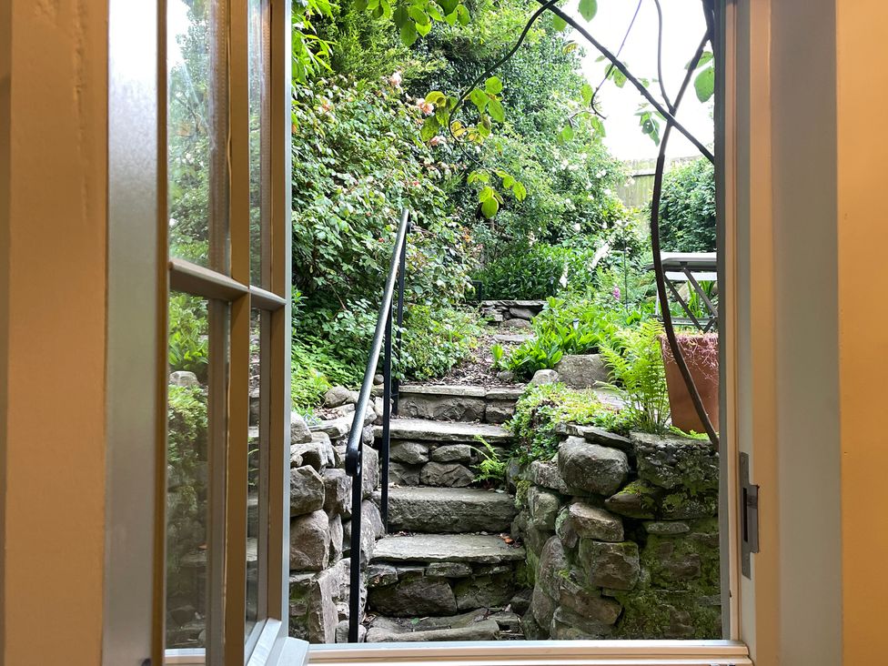 A view of steps and plants from a window at 3 Chapel Square in Brookhouse near Caton