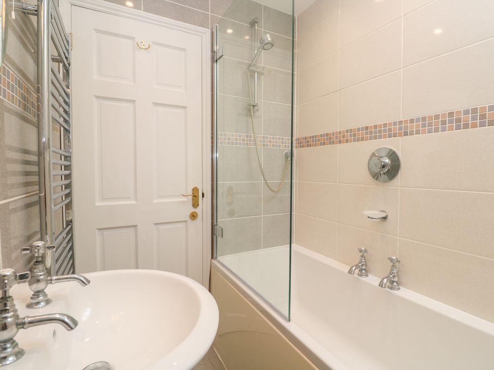 A bathroom with a shower and sink at 23 Carncrows Street St Ives