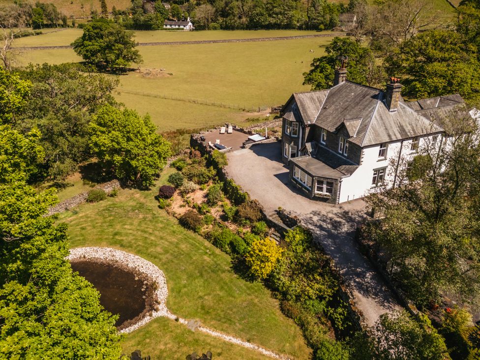 An outdoor view of a house and garden at Leathes Head Country House Borrowdale near Keswick